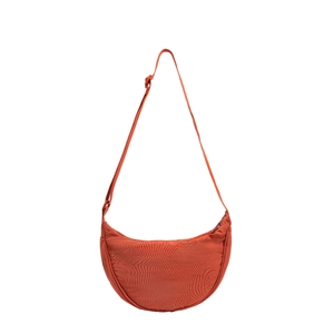 Orange nylon crescent crossbody bag with adjustable strap and zip closure on white background