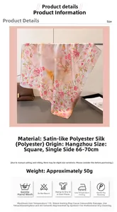 Detailed view of pink floral satin silk scarf showing print quality and texture