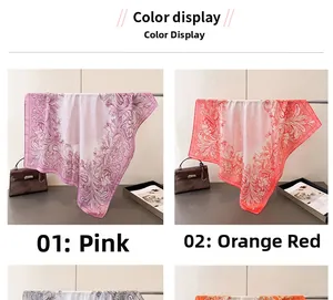 Detailed drape of floral silk scarves in pink and orange with elegant scroll patterns