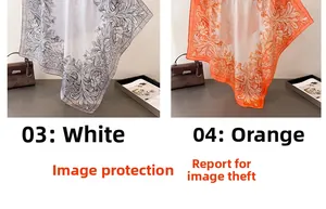 Detail of floral print silk scarves in white and orange with baroque patterns