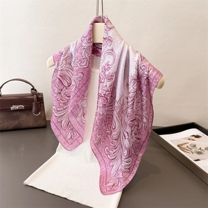 Pink and purple baroque floral silk scarf draped over a white vest for stylish layering