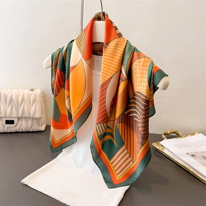 Elegant geometric print silk-like square scarf with retro patterns on a display mannequin