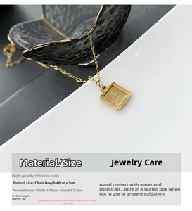 Detail of gold titanium steel photo frame pendant with 'Take your memory' engraving