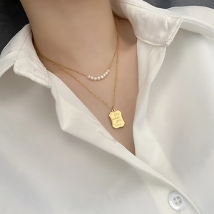 Double-layered gold titanium necklace with pearls and 'Do what you love' pendant