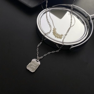 Double-layered silver titanium steel necklace with engraved tag and natural pearls