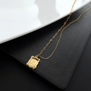 Gold titanium steel necklace featuring a vintage frame pendant with engraved memory quote