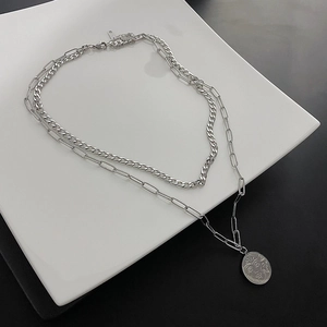 Double-layered titanium steel necklace with paperclip chain and portrait coin pendant