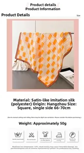 Detailed texture of orange and cream checkered satin scarf showing smooth fabric quality