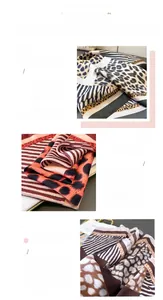 Close-up of leopard and zebra print faux silk scarf showing fine texture and hem stitching