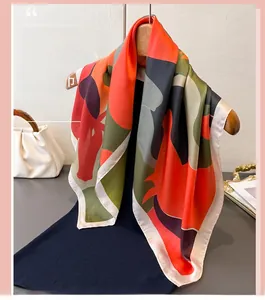Detail of artistic geometric print silk scarf with luxury texture and vibrant colors