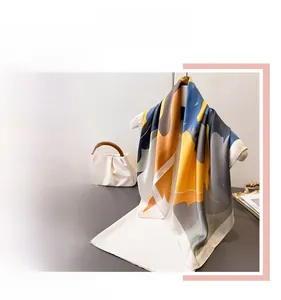 Detailed view of printed silk scarf featuring abstract horse silhouette patterns