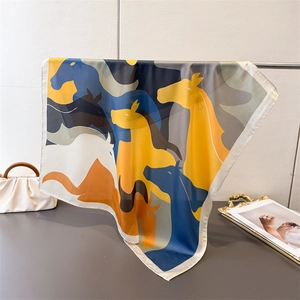 Detail of artistic horse head print on silk square scarf with vibrant modern colors