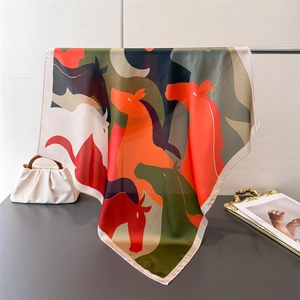 Elegant luxury silk scarf with abstract horse pattern and vibrant satin finish