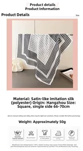 Détail d'un foulard en satin pied-de-poule avec instructions d'entretien