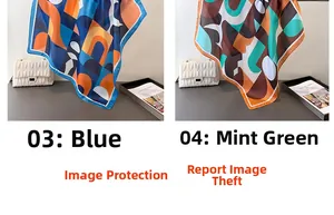 Détail d'un foulard en soie aux motifs géométriques avec une bordure roulée raffinée