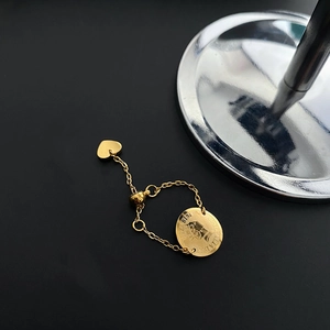 Bague fleur ajustable avec pendentif pièce Elizabeth II et breloque cœur sur chaîne dorée