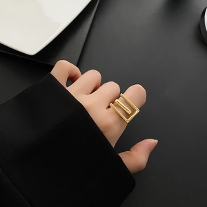 Chic 18k gold plated geometric layered ring shown on model finger for a modern style