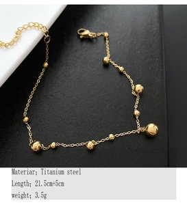 Detail showing gold titanium steel ball anklet with 21.5cm length and extension chain