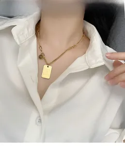 Detailed shot of gold titanium necklace with rectangular Dear Love You pendant