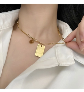 Detailed close-up of gold titanium steel necklace with Dear LOVE YOU engraved pendants