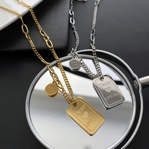Minimalist titanium steel necklace with engraved rectangular pendant on mirror surface