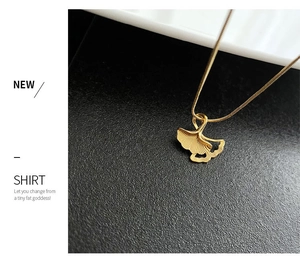 Close-up of golden ginkgo leaf pendant featuring delicate leaf vein texture on a snake chain