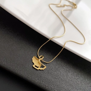 Golden ginkgo leaf necklace in titanium steel featuring a delicate snake bone chain