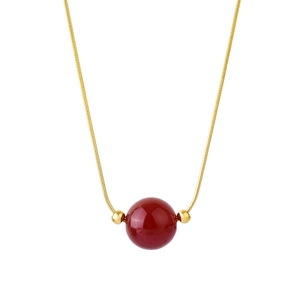 Minimalist titanium steel gold snake chain necklace with a red bead pendant for women