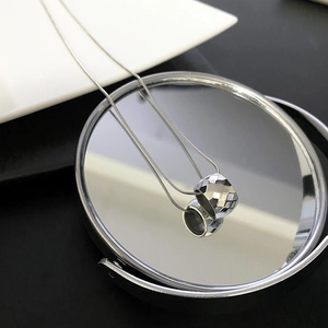 Polished silver titanium steel necklace with diamond-cut cylinder pendant and snake chain