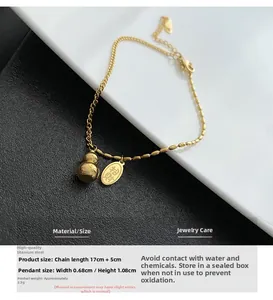 Close-up of a gold gourd pendant with a Fortune tag on a 18K titanium steel bracelet