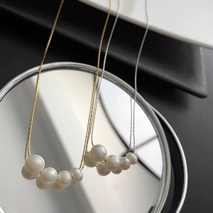 Elegant titanium steel necklace featuring natural freshwater pearl clusters in gold and silver