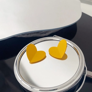 Matte yellow heart-shaped earrings with 3D V-shaped design on silver mirror base