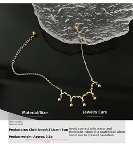 Detailed view of titanium steel anklet with golden beads and technical size specifications