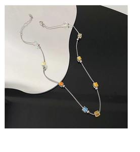 Detailed top view of a silver titanium steel necklace with iridescent crystal square beads