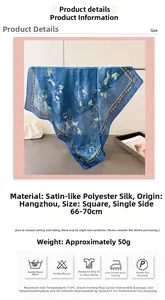 Detail view of blue floral silk-like square scarf with product dimensions and care icons