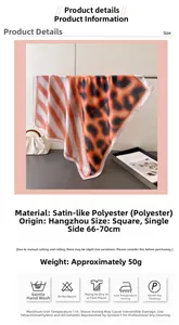 Detail view of square leopard and stripe print scarf showing satin silk texture and size