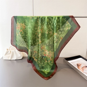 Elegant emerald green silk scarf with floral and bamboo prints for women in a square shape