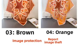 Close-up of retro geometric star patterns on silk-like scarves in brown and orange tones