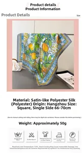 Detailed view of square silk scarf with lemon and floral prints and satin finish texture
