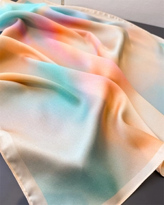 Close-up of silk-feel gradient scarf showing detailed rolled edges and smooth texture
