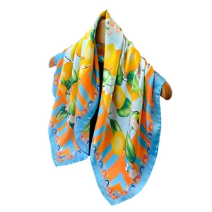 Vibrant square silk scarf featuring lemon and leaf prints on blue and orange stripes