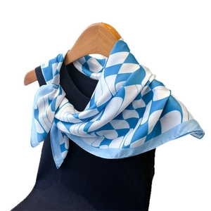 Elegant sky blue and white geometric silk-like satin scarf on black collar hanger