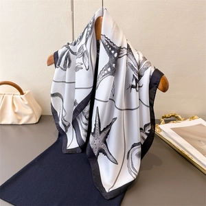 Nautical print silk scarf with starfish design on hanger with elegant pearl white finish