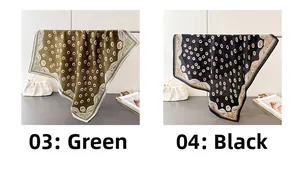 Dettaglio di foulard stampati in verde e nero con eleganti bordi a pois smerlati