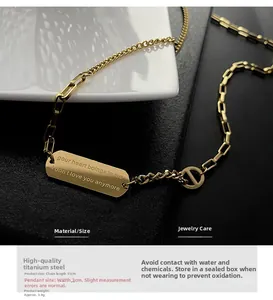 Macro detail of gold-plated titanium steel necklace with engraved pendant and D-link buckle