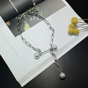 Modern silver link necklace with three white pearls in a Y-shaped elegant design