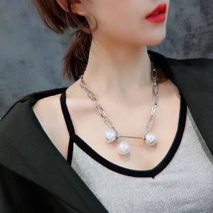 Minimalist silver chunky chain necklace featuring three elegant white pearl pendants