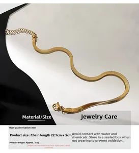 Detail of 18K gold snake chain anklet in titanium steel with measurements and length