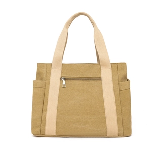 Sac fourre-tout minimaliste en toile kaki avec poignées blanc cassé et poche zippée latérale