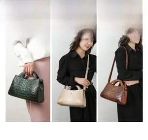 Three-way display of crocodile texture tote bag in green, cream, and brown styles